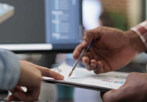 close-up-3d-digital-artists-reviewing-sketch-scene-plan-simulated-render-times-creative-industry-enthusiasts-with-cad-open-background-discussing-